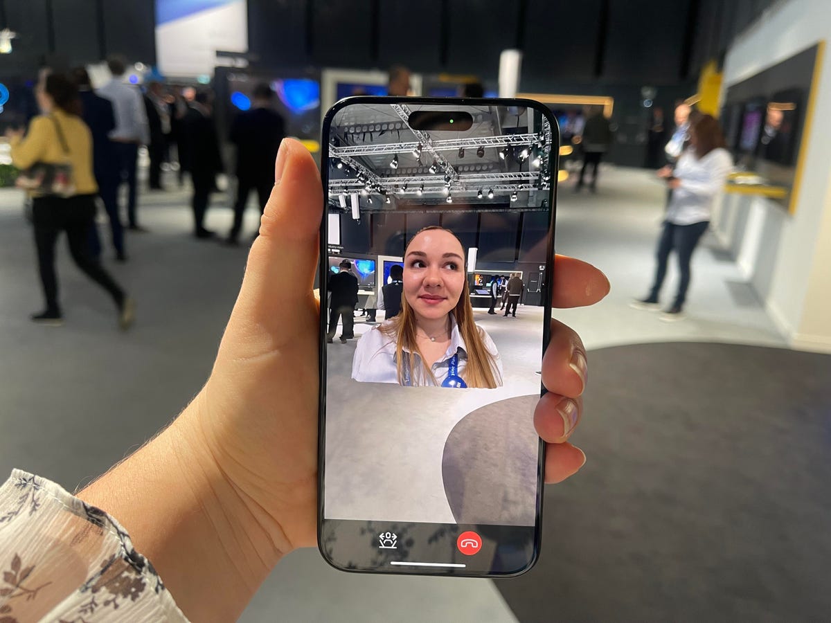 Phone screen showing hologram woman